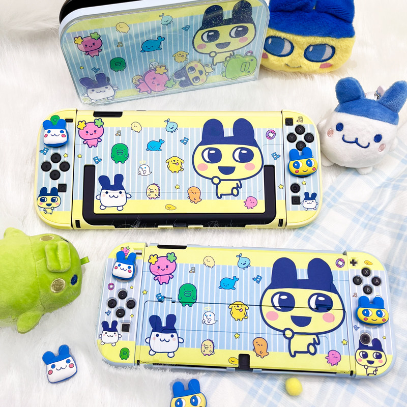 Bandai Model Tamagotchi - เคสการ์ตูนน่ารักสำหรับ Nintendo Switch 2 ป้องกันการกระแทก พร้อมฝาครอบจอยสติ๊กแบบนิ่มสำหรับ